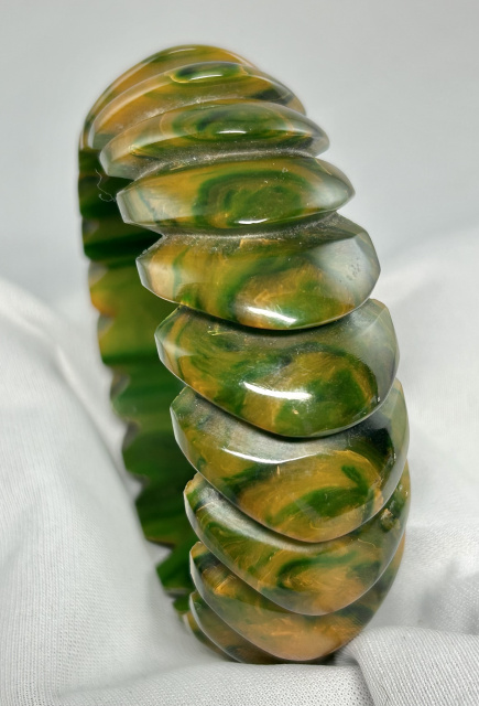 BB418 wide marbled green pinwheel carved bakelite bangle
